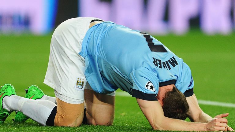 James Milner of Manchester City falls to his knees during the UEFA Champions League Round of 16 second leg match against Barcelona