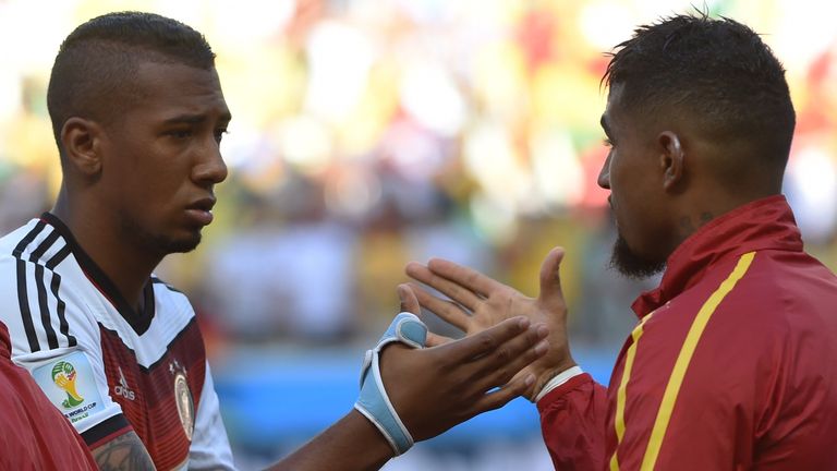 Jerome Boateng (L) shakes hands with his brother, Ghana's forward Kevin-Prince Boateng prior to a Group G football match between Germany and Ghana