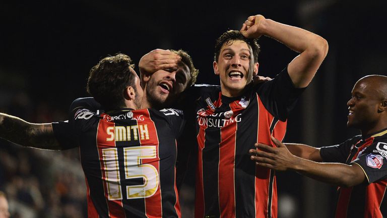 LONDON, ENGLAND - MARCH 06:  Steve Cook of Bournemouth (2L) celebrates with Adam Smith (15),  Tommy Elphick (2R) and Tokelo Rantie (R) as he scores their f
