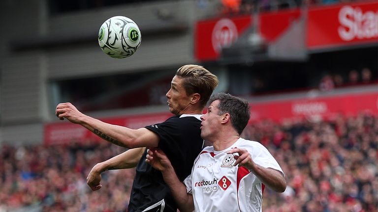 Fernando Torres of the Gerrard XI in action with Jamie Carragher of the Carragher XI during the Liverpool All-Star Charity match at Anfield.