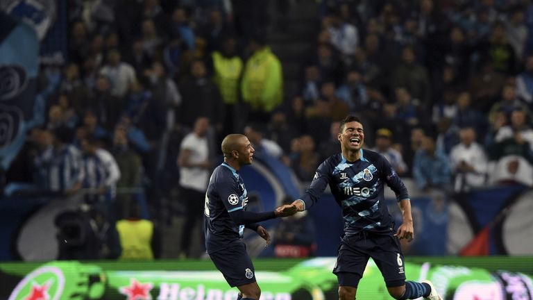 Porto's  midfielder Casimiro (R) celebrates after scoring a goal during the UEFA Champions League round of 16 