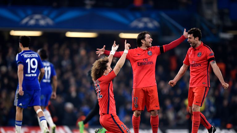 Paris St Germain's David Luiz celebrates at full time with Maxwell (centre) and Thiago Motta (right) 