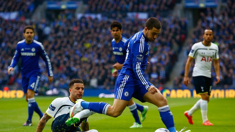 Kyle Walker of Spurs goes in to tackle Eden Hazard of Chelsea during the Capital One Cup Final match between Chelsea and Tottenham at Wembley Stadium