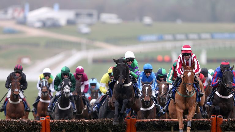 Zabana ridden by Robert Colgan (right) leads the field in the early stages of the Coral Cup on Ladies Day during the Cheltenham Festival at Cheltenham Race