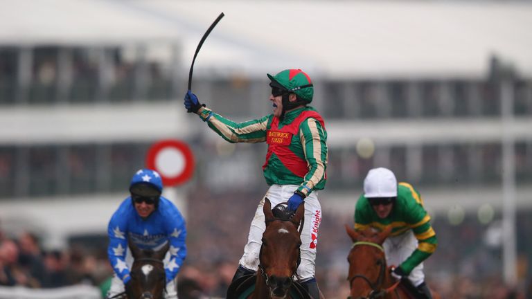 CHELTENHAM, ENGLAND - MARCH 11:  Tom Scudamore riding Moon Racer celebrates winning the Weatherby's Champion Bumper Open Natuonal Hunt  Flat Race during da