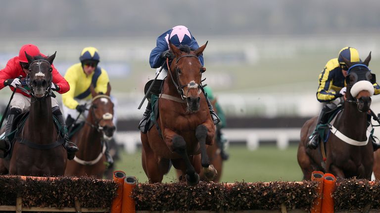 Qualando ridden by Nick Scholfield (centre) jumps clear to go on to win the Fred Winter Juvenile Handicap Hurdle