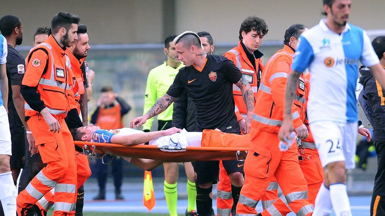 Federico Mattiello  is stretchered off the field during  Chievo's clash with Roma