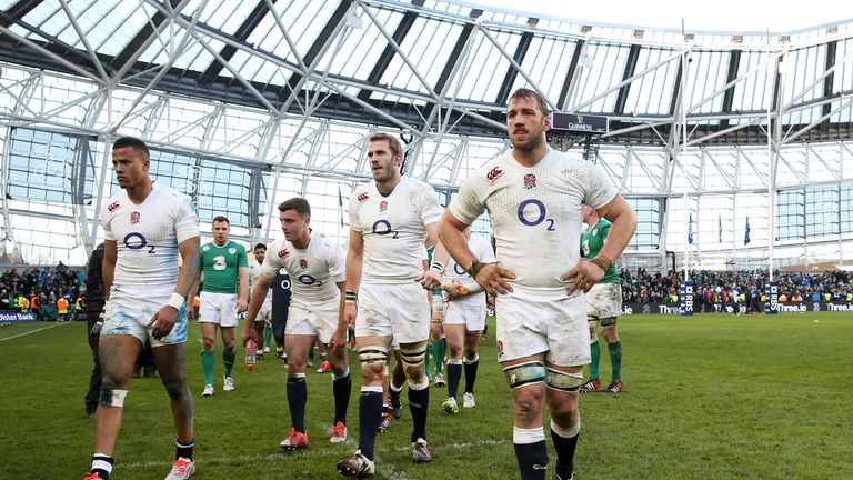 A dejected Chris Robshaw walks off with his England team