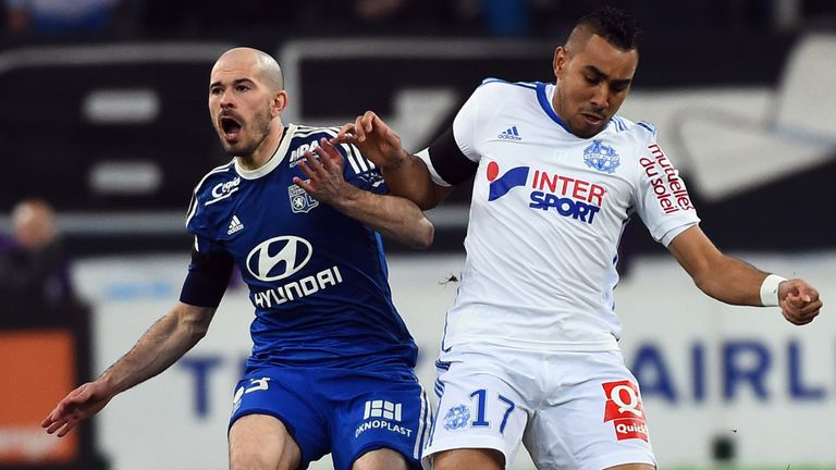 Lyon's French defender Christophe Jallet   (L) vies with Marseille's French forward Dimitri Payet  (R)  during the 
