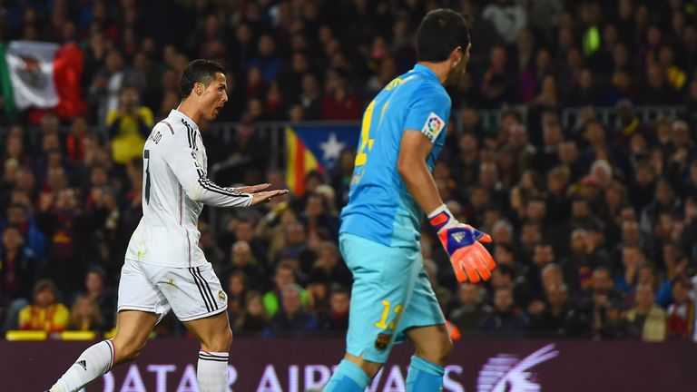 Claudio Bravo looks on as Cristiano Ronaldo celebrates
