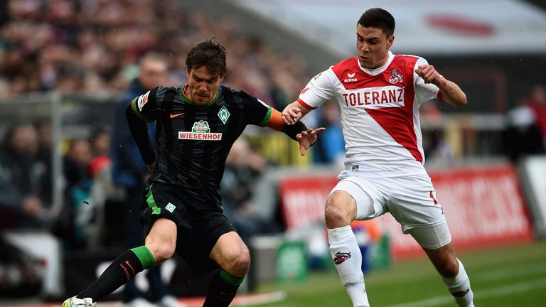 Clemens Fritz of SV Werder Bremen and Jonas Hector of 1. FC Koeln battle for the ball during the Bundesliga match between 1. FC Koeln and SV Werder Bremen