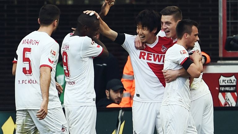 Yuya Osako celebrates after scoring Cologne's third goal