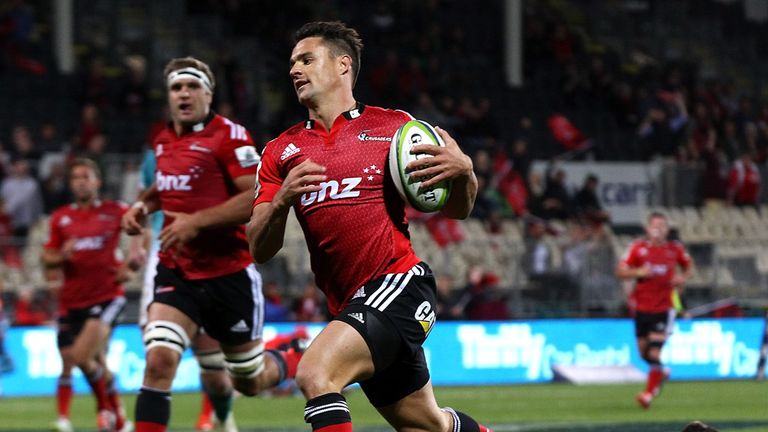  Dan Carter of the Crusaders runs in to score a try against the Cheetahs
