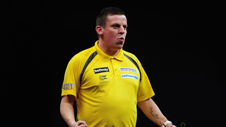 Dave Chisnall of England celebrates his victory over Gary Anderson of Scotland during The Betway Premier League Darts in Exeter
