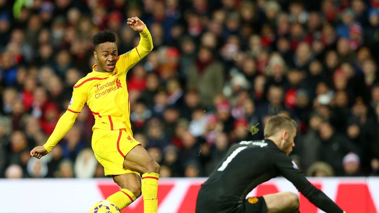 David De Gea of Manchester United saves the attempt on goal of Raheem Sterling of Liverpool in a one on one situation in December 2014