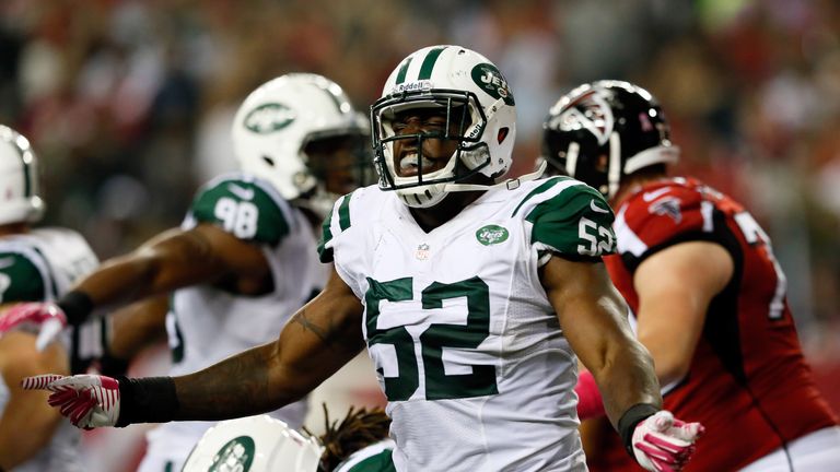 Inside linebacker David Harris #52 of the New York Jets celebrates a fourth down stop against the Atlanta Falcons 