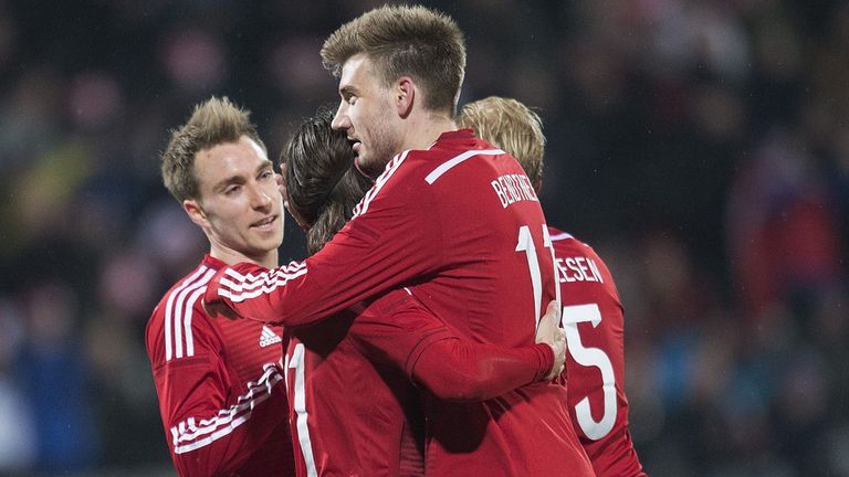 Denmark's Nicklas Bendtner celebrates with teammates after scoring