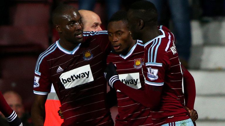 Diafra Sakho of West Ham celebrates with team-mates after scoring the winning goal 