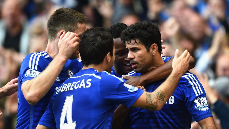 Diego Costa of Chelsea celebrates scoring their second goal with Cesc Fabregas of Chelsea during the Premier League match against Arsenal in October 2014