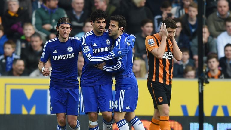Diego Costa of Chelsea (2L) celebrates with Filipe Luis (L) and Cesc Fabregas (2R)