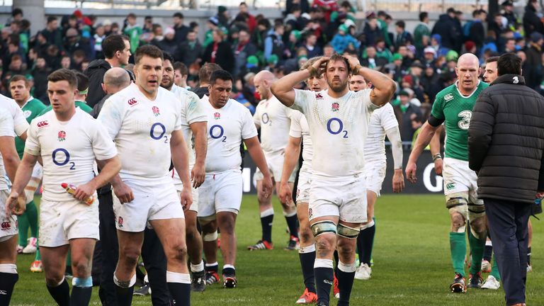 A dejected Chris Robshaw of England leads off his team