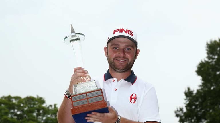 Andy Sullivan of England poses with the trophy after winning the Joburg Open at Royal Johannesburg and Kensington