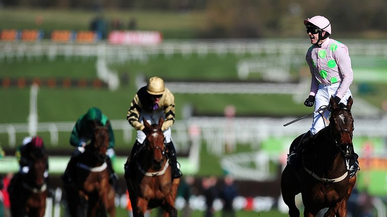 CHELTENHAM, ENGLAND - MARCH 10:  Ruby Walsh celebrates on board Douvan as they cross the line to win The Sky Bet Supreme Novices' Hurdle.