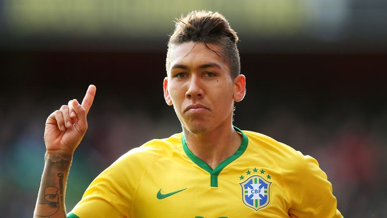 Firmino of Brazil celebrates after scoring the opening goal during the international friendly match between Brazil and Chile