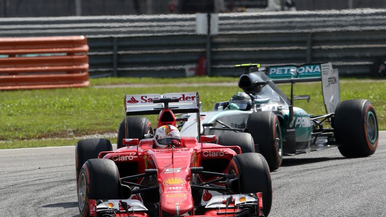 Sebastian Vettel heads the Mercedes of Nico Rosberg