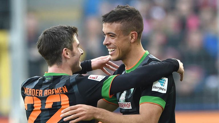 FREIBURG GERMANY - MARCH 7: Fin Bartel (L) and Di Santo of Werder Bremen celebrates Di Santo's goal during 