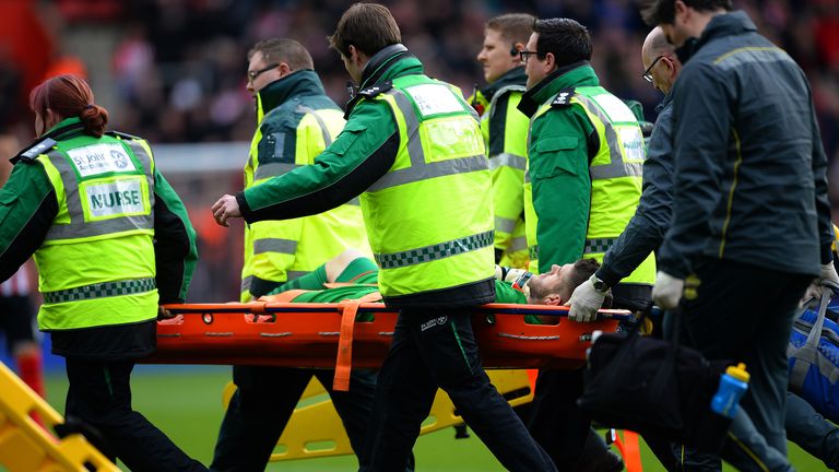 Fraser Forster of Southampton is stretched off the pitch 