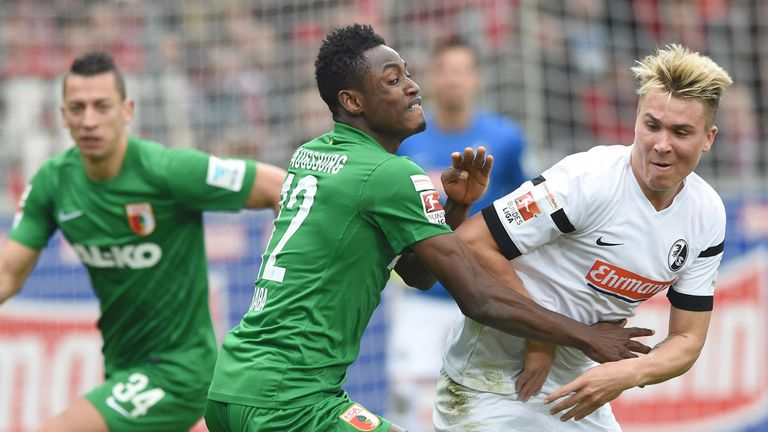 Felix Klaus (R) of SC Freiburg challenges Abdul Rahman Baba of FC Augsburg