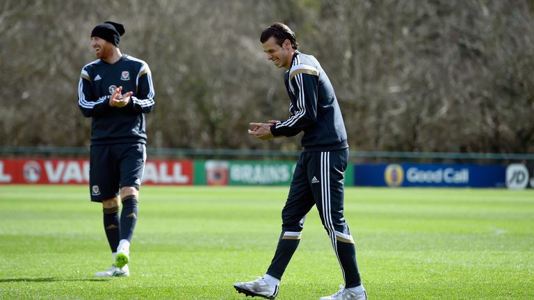 CARDIFF, WALES - MARCH 25:  Wales player Gareth Bale (r) shares a joke with James Collins during training ahead of this weekend's game against Israel at th