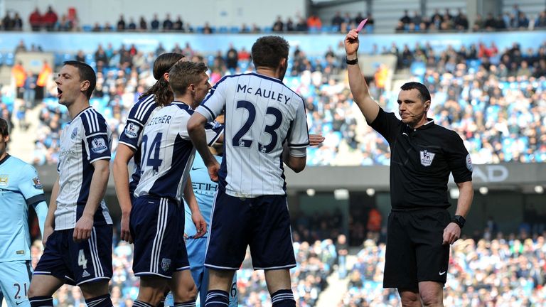 West Bromwich Albion's Northern Irish defender Gareth McAuley (2nd R) is shown the red card and sent off 