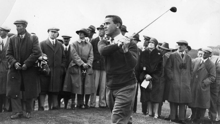 Gene Sarazen of the USA taking a shot, surrounded by spectators.  