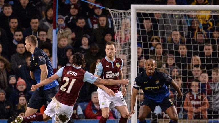 Burnley's Scottish midfielder George Boyd (L) shoots to score the opening goal of the English Premier League 