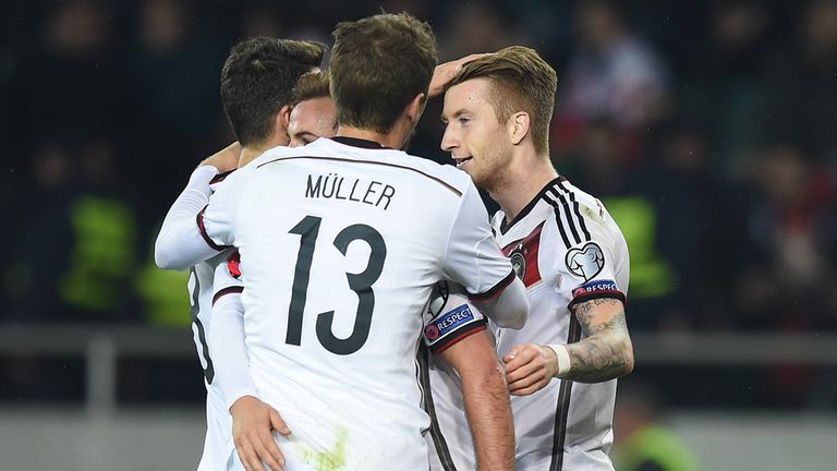 Marco Reus of Germany celebrates with his team-mate after scoring his team's first goal against Georgia