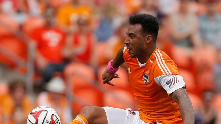 Giles Barnes of the Houston Dynamo works the ball against the Portland Timbers