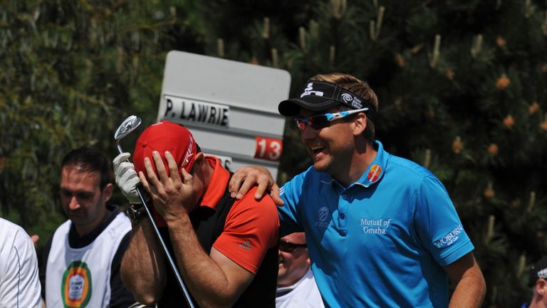 Oops! Ian Poulter expresses his sympathy after a wayward Strauss shot during the Zone Golf Charity Shoot Out