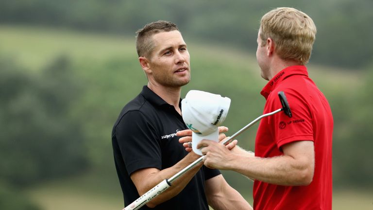 Trevor Fisher Jnr is congratulated by Matt Ford after winning the Africa Open by five shots