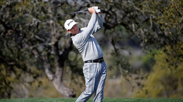 Graeme McDowell of Northern Ireland takes his second shot on the 18th hole during round one of the Valero Texas Open at TPC Sa