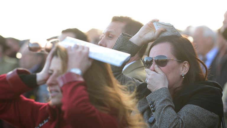 Racegoers react as Annie Power falls during The OLBG Mares' Hurdle Race