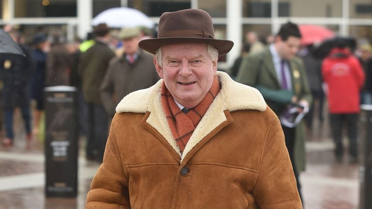 John Motson arrives on Gold Cup Day during the Cheltenham Festival at Cheltenham Racecourse. PRESS ASSOCIATION Photo. Picture date: Friday March 13, 2015. 