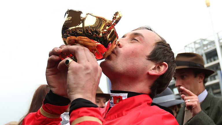 Jockey Nico de Boinville kisses the Cup after Coneygree's thrilling win
