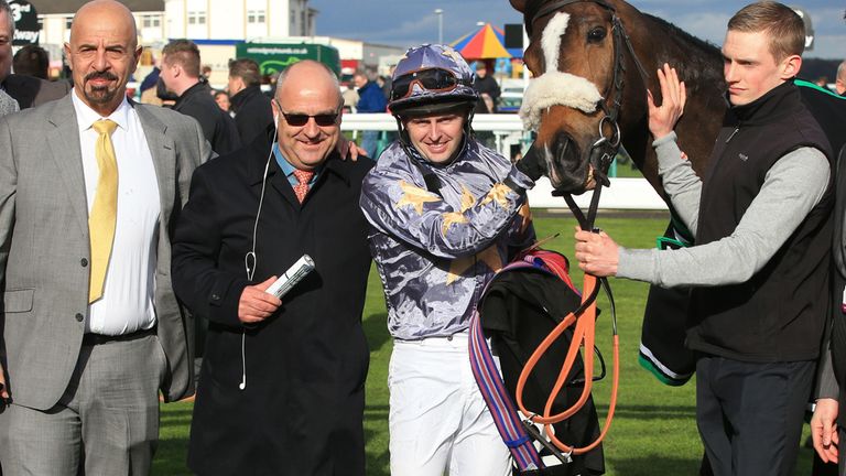 Owner of Gabrial Dr Marwan Kokash (2nd left) celebrates his win of  The Betway Lincoln Heritage Handicap with jockey Tony Hamilton and playing members of t