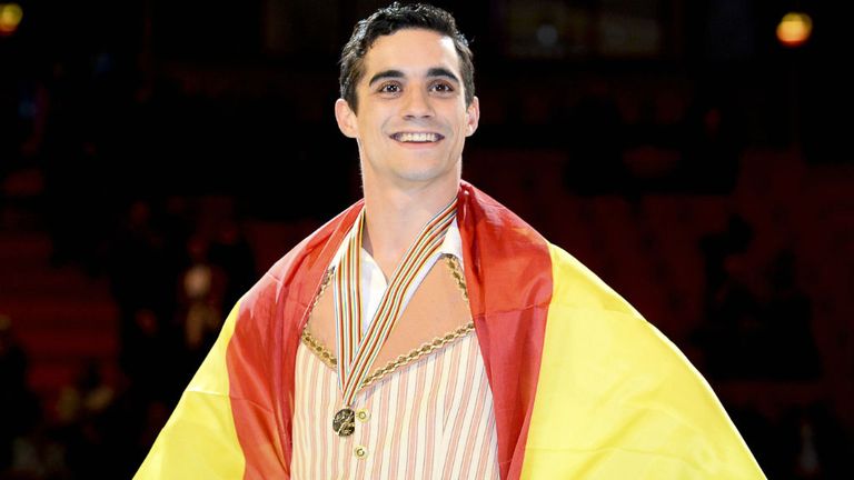 Javier Fernandez shows his gold medal after performing at the men free skating category of the ISU European Figure Skating Championships 