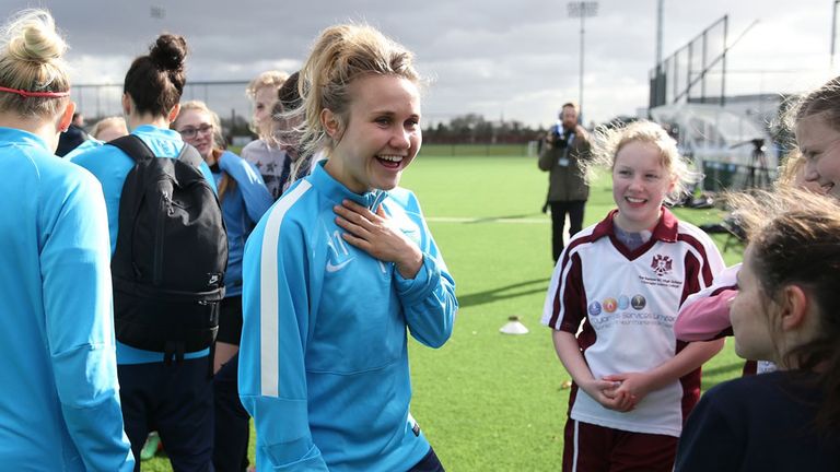 Izzy Christiansen with schoolgirls at the City Academy