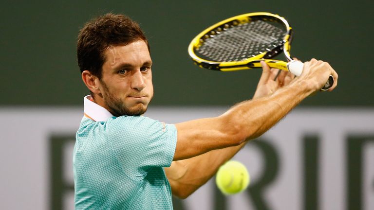 James Ward of Great Britain in action against Mitchell Krueger of USA during day two of Indian Wells