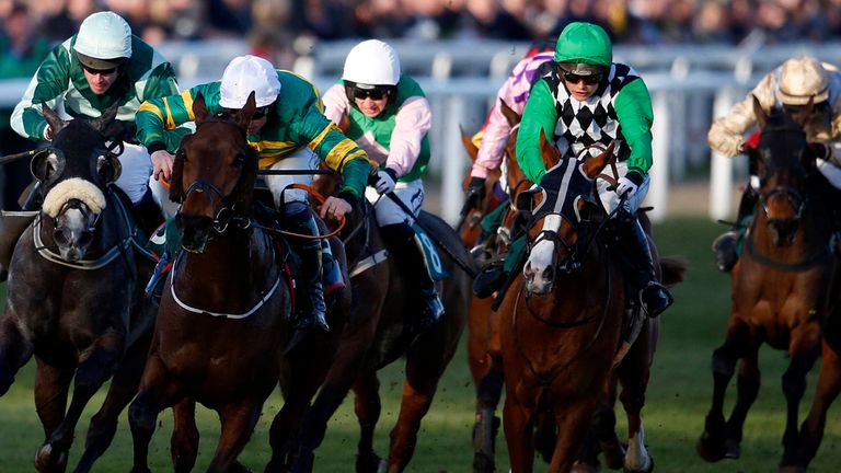 Jamie Codd riding Cause Of Causes (2nd left) wins the Toby Balding National Hunt Chase at Cheltenham 