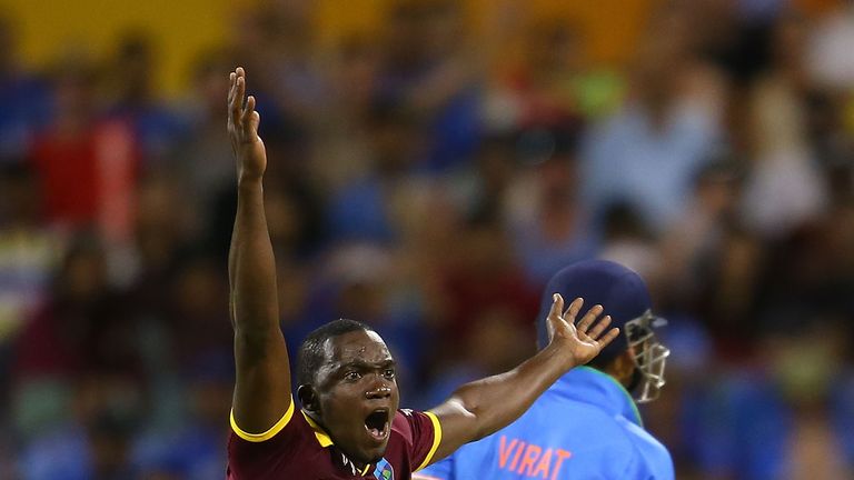 Jerome Taylor of the West Indies appeals unsuccessfully for the wicket of Virat Kohli of India